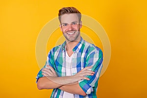 Confident smile. Confident guy portrait yellow background. Smiling confidence