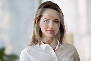 Confident smiling businesswoman looking at camera, young profess