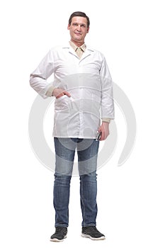 Confident smiling doctor standing with hand in pocket,
