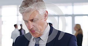 Confident, smiling and mature business man at a meeting, seminar or conference in a convention center for work. Portrait