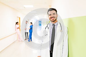 Confident Smiling Mid Adult Doctor At Hospital