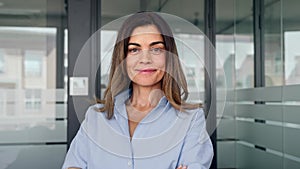 Confident smiling middle aged business woman in office, portrait.