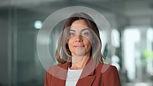 Confident smiling professional middle aged business woman in office, portrait.