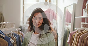 Confident smiling woman retail seller, entrepreneur, clothing store small business owner, looking at camera