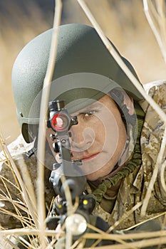 Confident Soldier Aiming Through Gunsight