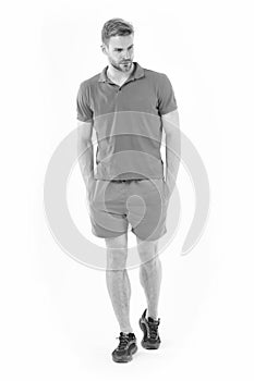 Confident sportsman. Full length handsome fit man in blue sports clothing and sneakers isolated white background