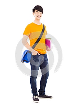 Confident student holding books and slanting knapsack photo