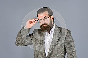 Confident and stylish. mens jacket wardrobe. fashionable man wear glasses. formal fashion model. handsome man on gray