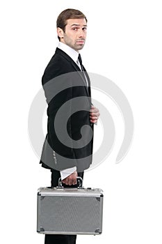 Confident stylish security guard whith a metal suitcase.