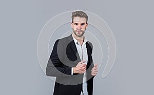 Confident and stylish. sexy ceo on gray background. modern office life. charismatic business owner. stylish realtor