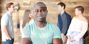 Confident successful black business man in front of group of people.