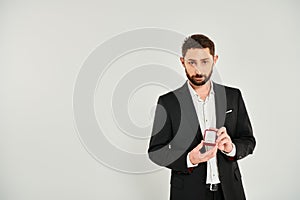 confident successful businessman showing jewelry box