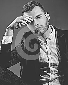 Confident and successful. Handsome young man in a business suit. Elegant handsome business man isolated on black