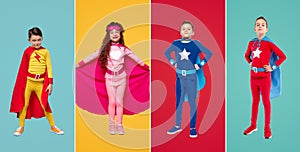 Confident superhero kids in colorful costumes in studio