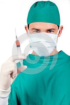 Confident surgeon holding a syringe photo