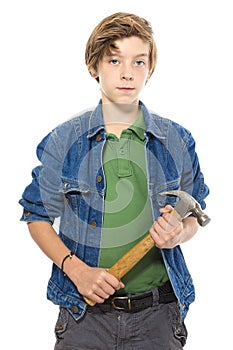 Confident teenage boy holding a hammer with both hands, isolated