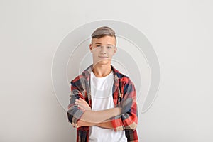 Confident teenage boy on white background