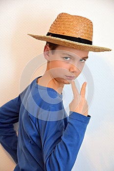 Confident teenager with straw hat photo