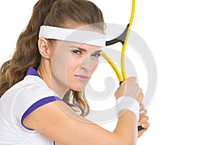 Confident tennis player ready to hit ball