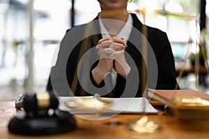 confident thoughtful businesswoman wearing suit sitting at work desk, pensive employee executive touching chin, solving