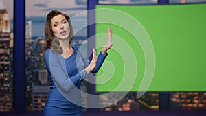 Confident tv presenter hosting newscast on green screen at studio close up. photo
