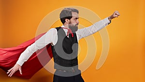 Confident waiter with red hero cape
