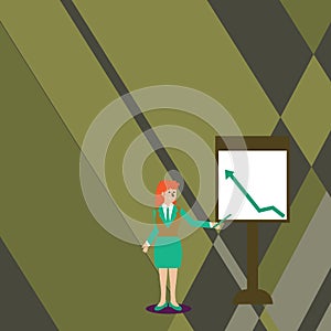 Confident Woman in Business Suit Holding Stick and Pointing to Chart of Arrow Going Up on Freestanding Whiteboard