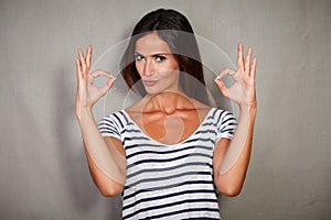 Confident woman congratulating with ok sign