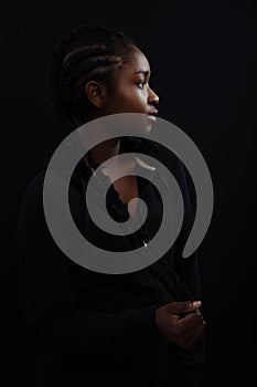 Confident woman with dark skin and cool attitude wearing hoody