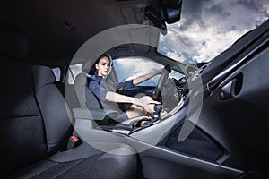 Confident woman driving a car