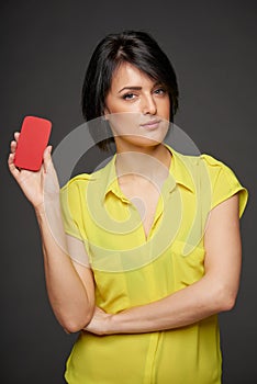 Confident woman showing blank credit card