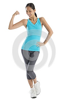 Confident Woman In Sports Clothing Flexing Muscles