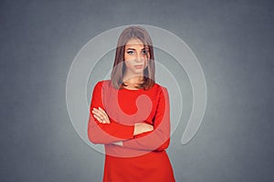 Confident woman standing with arms folded