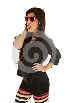 Confident woman wearing sunglasses and colorful leggings