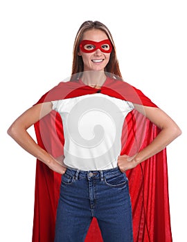 Confident woman wearing superhero cape and mask on white background