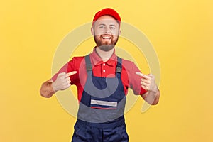 Confident worker man standing and pointing at himself, bragging about the result of his work.