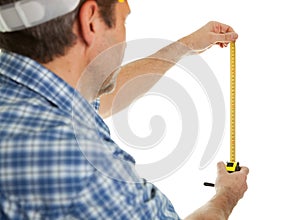 Confident worker measuring dimensions