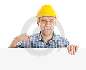 Confident worker presenting empty board