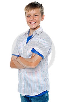 Confident young boy posing in casuals