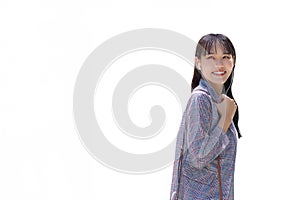 Confident young business Asian working woman who wears gray striped blazer while using smartphone with small talk smiles as she