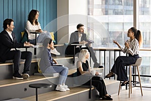 Confident young business coach, teacher woman presenting lecture