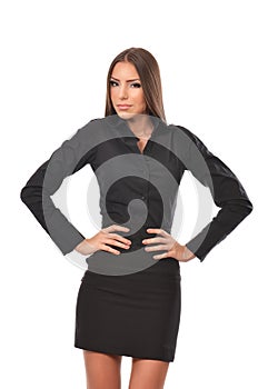Confident young business woman with hands on waist