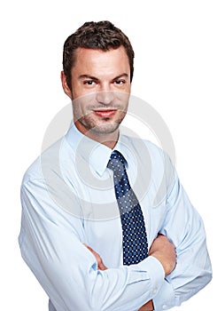 Confident young businessman. An experienced businessman crossing his arms while isoalted on a white background.