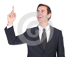 Confident young businessman smiling and pointing finger