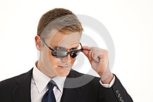 Confident young businessman with sunglasses