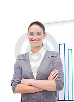 Confident young businesswoman with folded arms