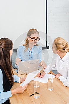 confident young businesswomen working together