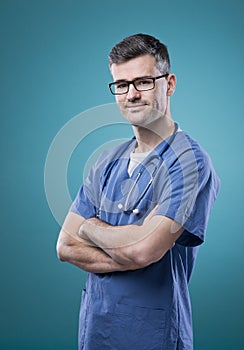 Confident young doctor posing