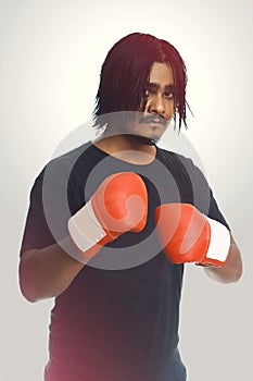 Confident Young Fitness Man Wearing Red Boxing Gloves