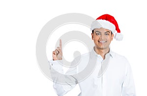 A confident young good looking man in santa's hat